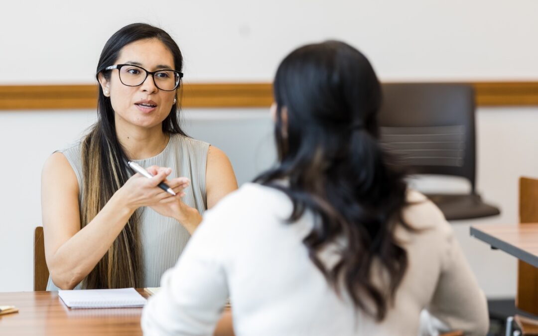 Woman giving feedback to employee